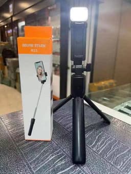 Selfie stick with bluetooth shutter